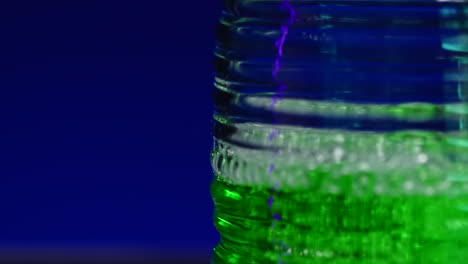 close-up of a green liquid in a plastic bottle