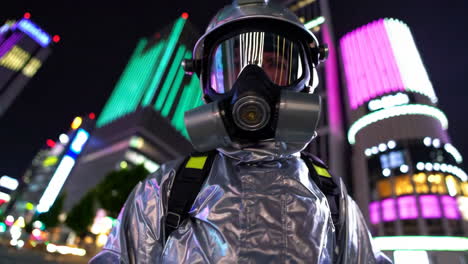 person in protective gear at night in city
