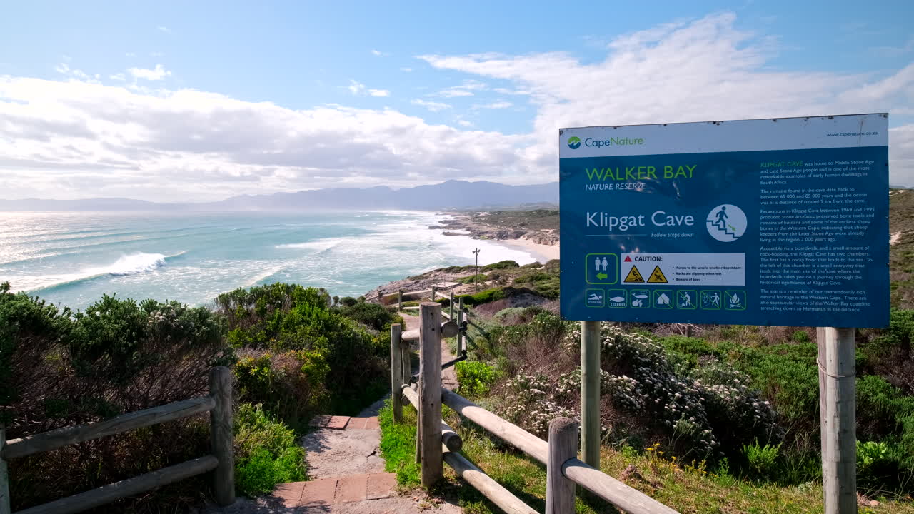 Path to Klipgat Cave in Walker Bay Nature Reserve with tourist information board