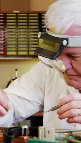 horologist repairing a watch