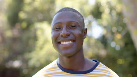 enjoying sunny day with multiracial male friends, smiling african american man outdoors, copy space