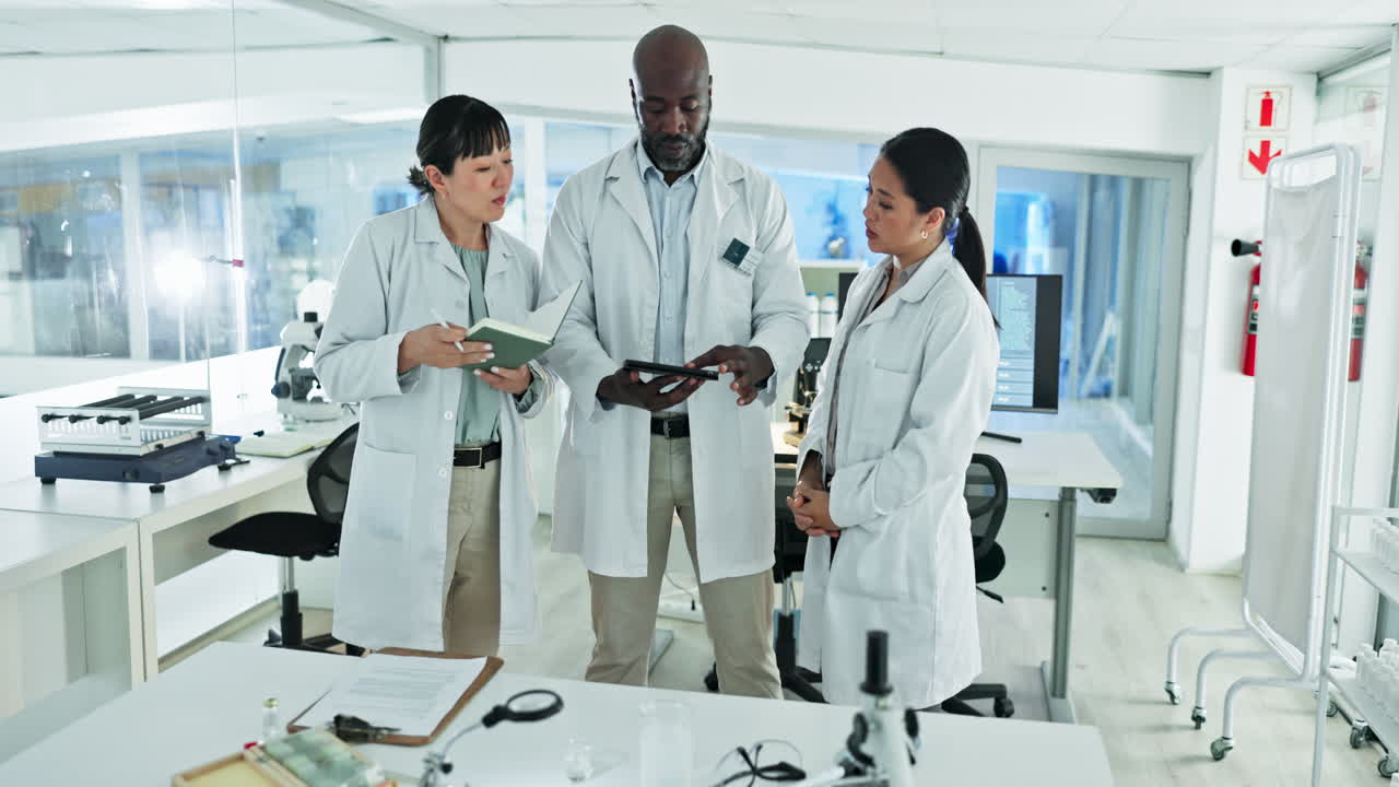 Tablet, teamwork or scientists talking