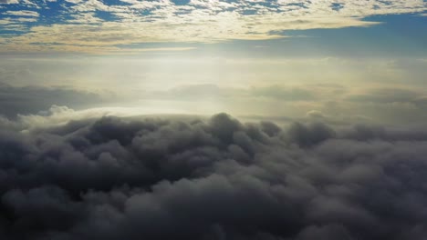 sunlight panorama view above massive clouds and fog, aerial shot