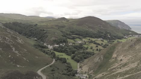 capelulo penmaenmawr welsh mountain coastal valley aerial view north wales pan left