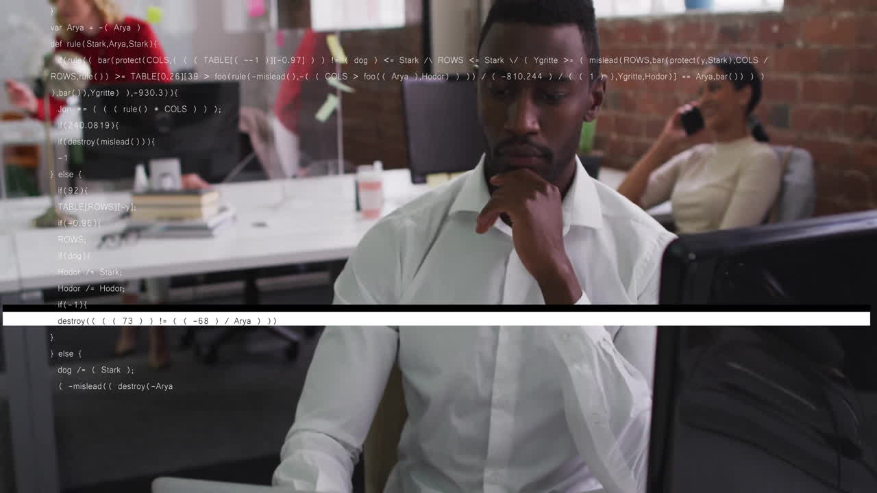 Man in white shirt working on computer with coding animation overlay
