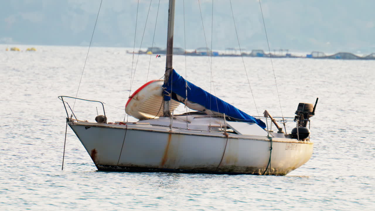 White boat docked on the sea on a cloudy day in Antibes, France