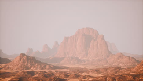 red desert landscape with misty mountains