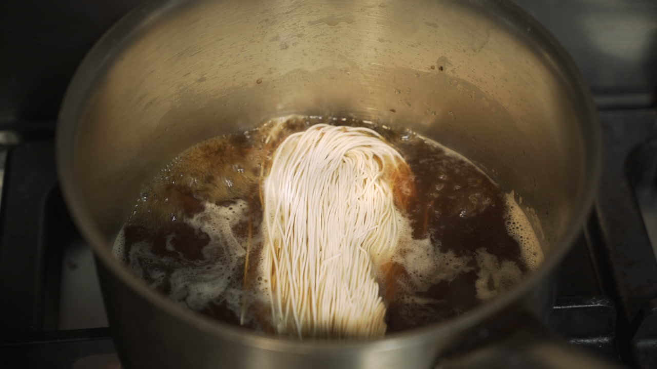 Noodles being cooked in a pot