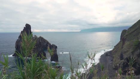 dramatic coastal view of volcanic rocks and ocean