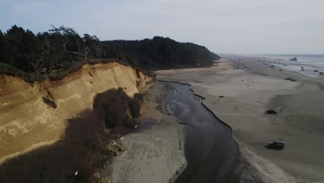 boone creek along forested cliff at the copalis beach in gray's harbor county, washington, usa