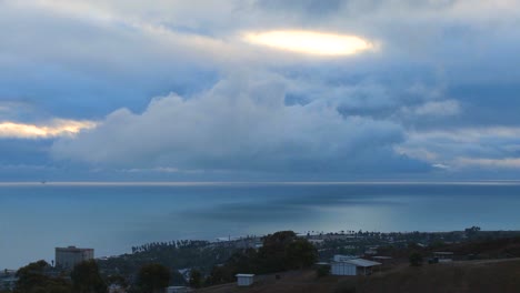 blue clouds hang over the ocean 1