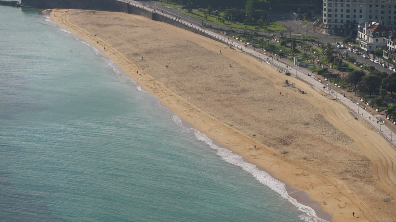 Closer view of San Sebastián’s long sandy beach and calm shoreline