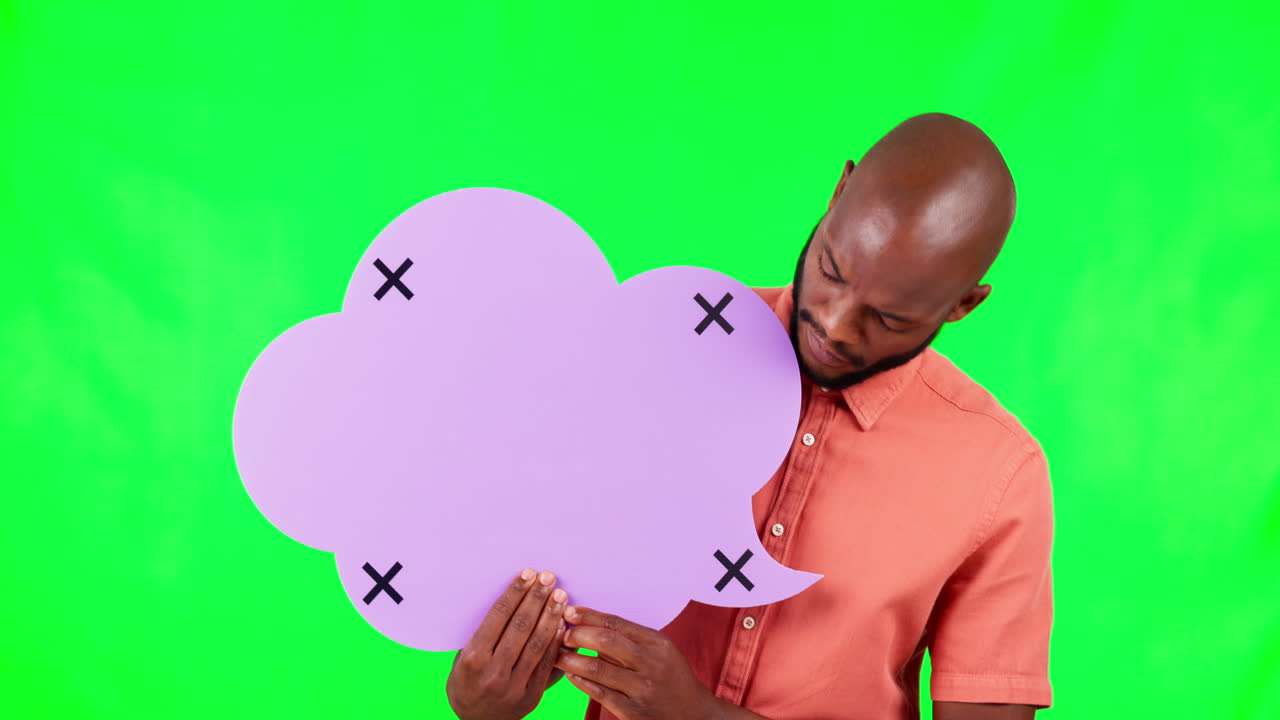 Man Holding a Purple Speech Bubble