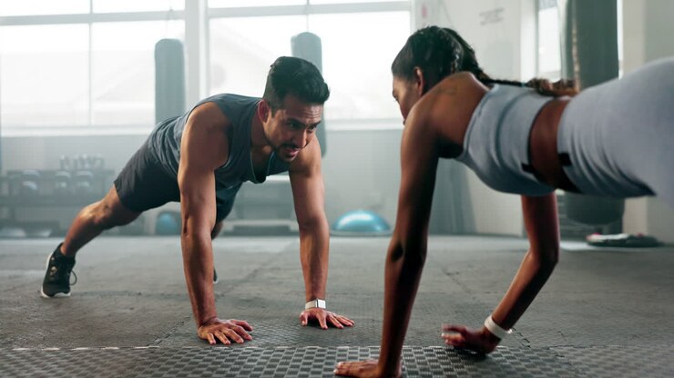 Fitness, plank and workout with people in gym
