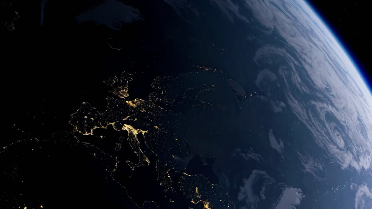 A stunning video still of Earth from space, showcasing city lights at night