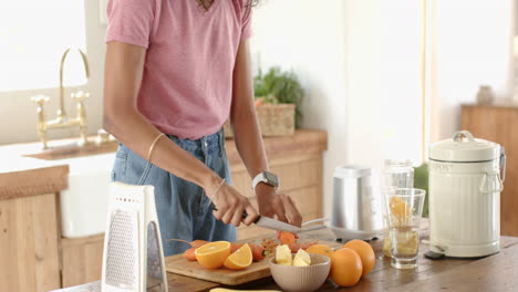 preparing fresh vegetables in kitchen, woman cooking with joy, at home