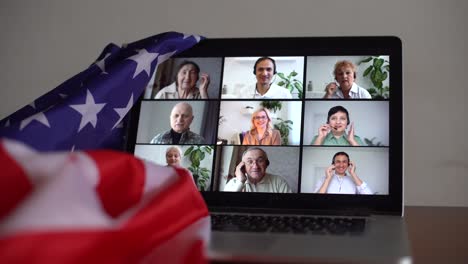 online party with loved ones from usa. celebrating video chat. virtual party via video messenger. americans are video chatting. flag of america next to computer