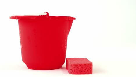 Close-up-of-plastic-bucket-and-cleaning-sponge