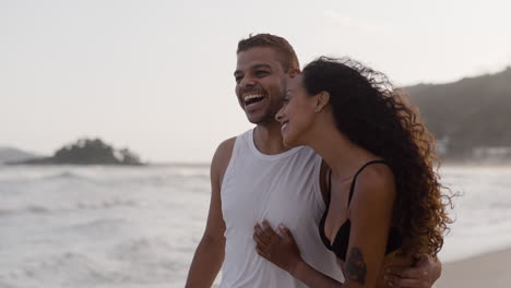 cute couple walking on the beach