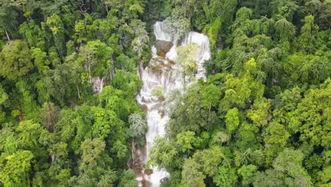 Aerial-Overhead-View-Of-Kuang-Si-Falls-Cascading-Down-Surrounding-By-Tropical-Forest-Trees-In-Luang-Prabang