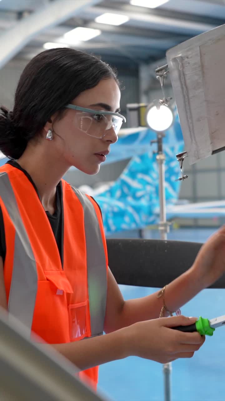 Aircraft Mechanic Working on Plane