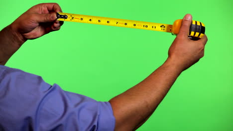 an arm in front of a green screen to be keyed and used at will