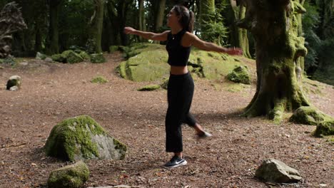 Side-portrait-of-aspiring-capoeira-artist,-summer-scene-in-forest