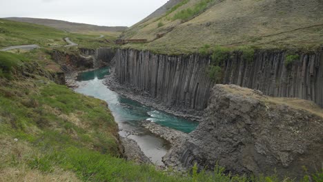 studlagil spectacular valley with interesting rock formations and a turquoise river