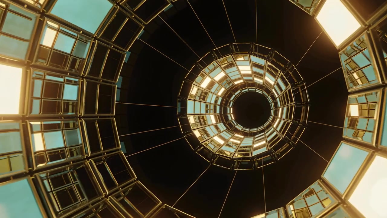 Kamera pelacak mendekati cincin konsentris di atrium, menyingkap geometri seperti terowongan dan panel-panel.