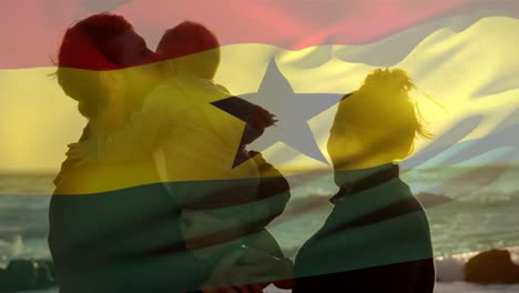 Animación-De-La-Bandera-De-Ghana-Sobre-Padres-Caucásicos-Con-Un-Niño-En-La-Playa.