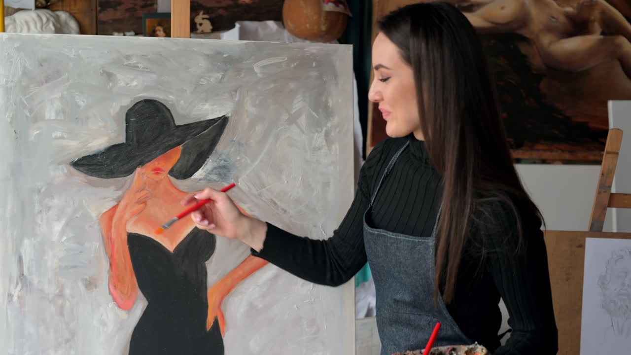Woman painting a female on a canvas at an art gallery workshop