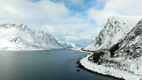 coastal road along the snowy mountains during daytime in lofoten island, norway