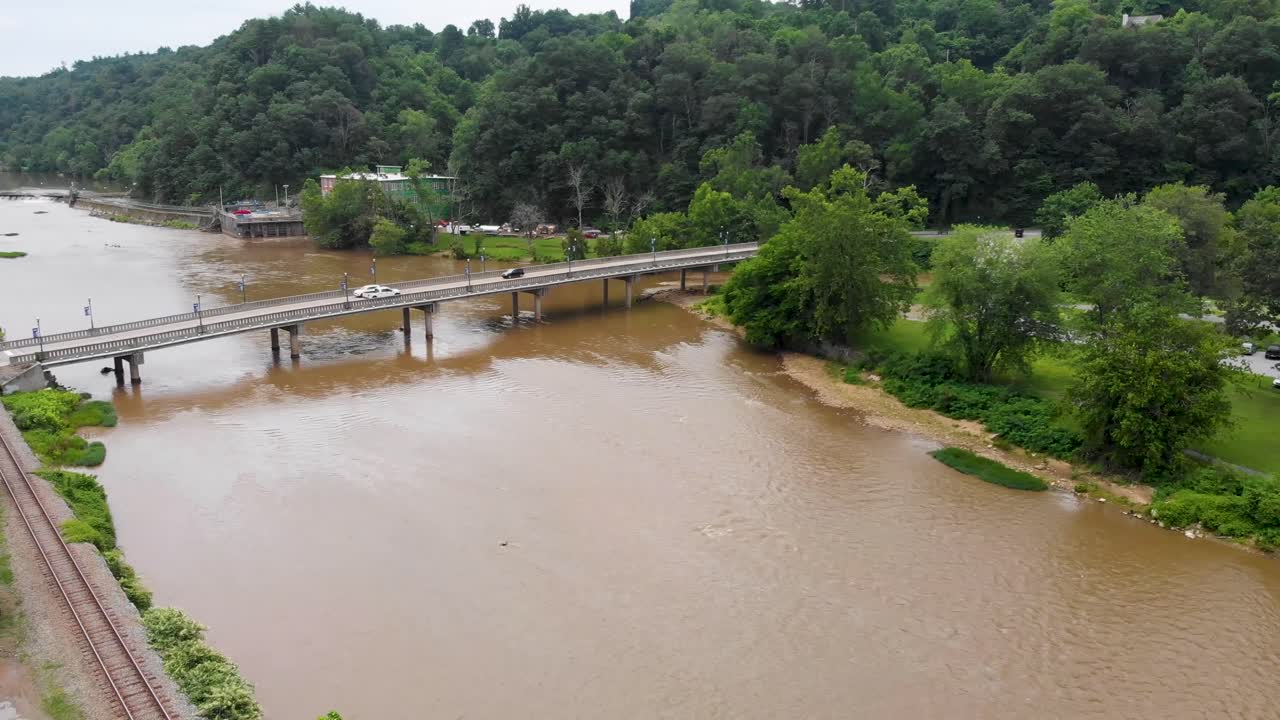 Aerial View of a Riverside Town with a Bridge