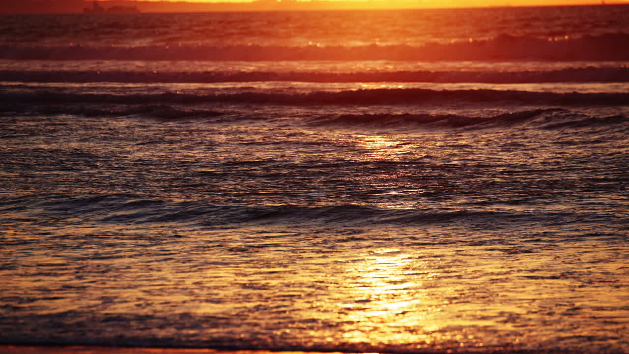 Vibrant Santa Cruz sunset with stunning ocean views, golden skies, and rolling waves—ideal for cinematic scenes, travel videos, or peaceful nature backgrounds.
