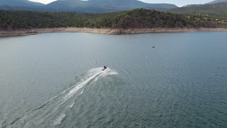 person riding a jet ski in flaming gorge reservoir, utah state, america