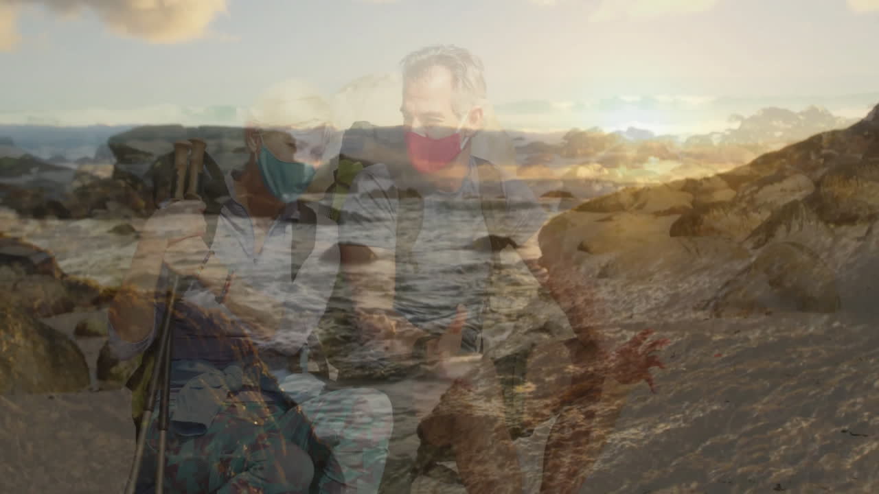 Hikers monitoring heart rate chart on rocky coastal sunset, with floating health icons and data