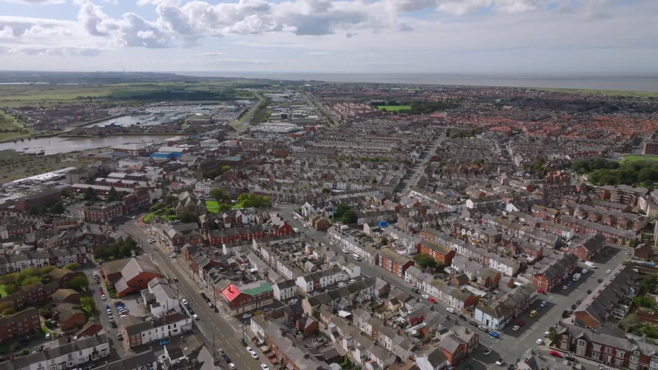 Flying Over The Town Of Fleetwood Showing Urban Street Structure And Marina With Derelict Docklands. Lancashire, UK