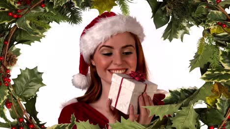 santa woman opening gift with holly border