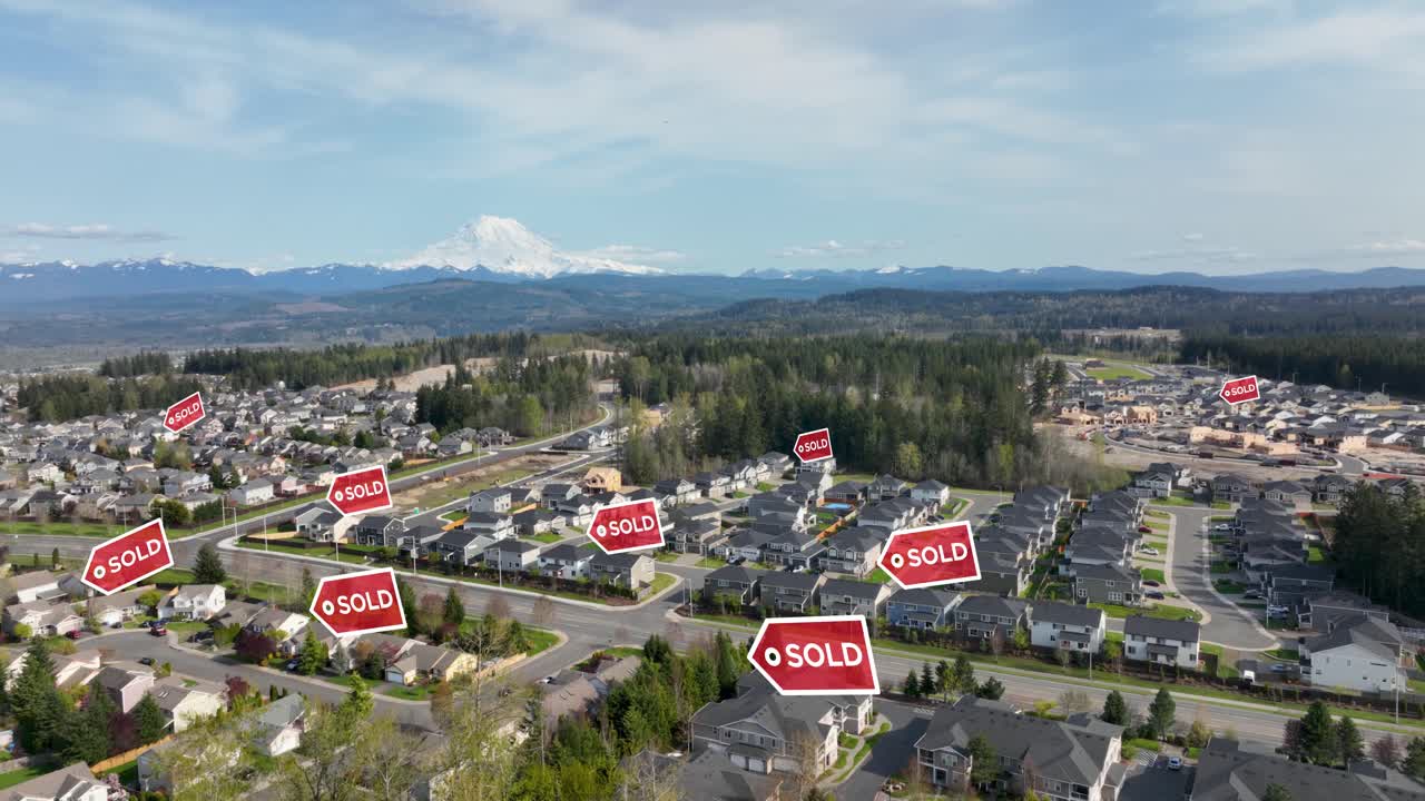 Aerial view of a suburban neighborhood with &amp;quot;SOLD&amp;quot; signs appearing above houses