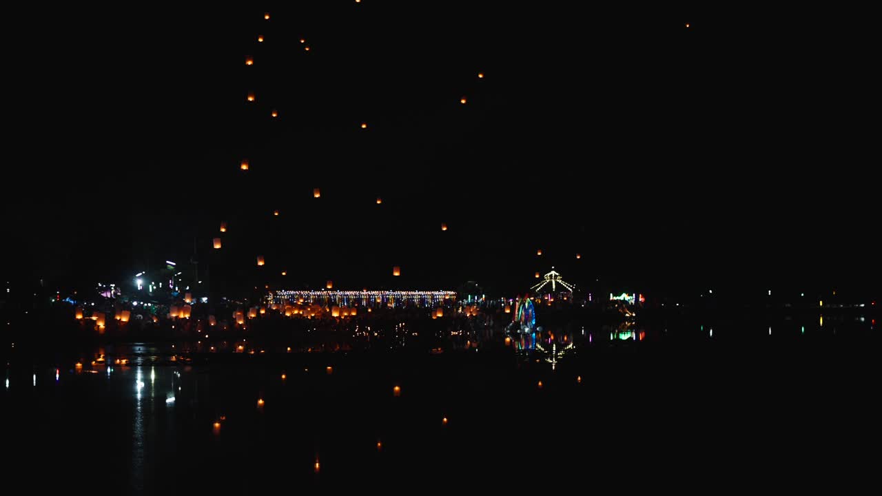 Night Sky Lanterns Festival over a Lake