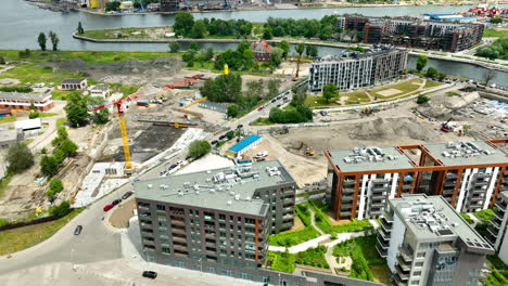 Aerial-view-of-Gdansk-with-construction-sites-and-modern-buildings---new-modern-location-and-buliding-near-old-Twon