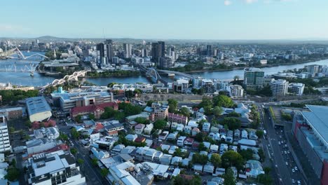 drone shot flying around petrie terrace suburb, with breathtaking views of brisbane river, brisbane city, south bank, west end, roma st station, many of brisbane's bridges in shot