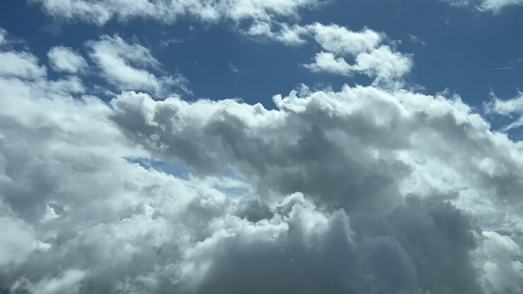 A pilot’s perspective: flying through a blue sky with some tiny cumulus