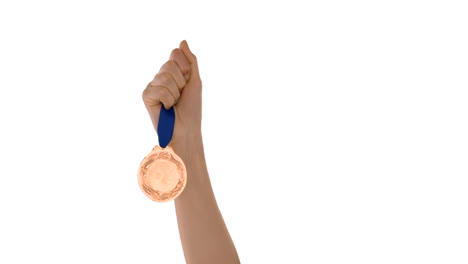 hands throwing a medal