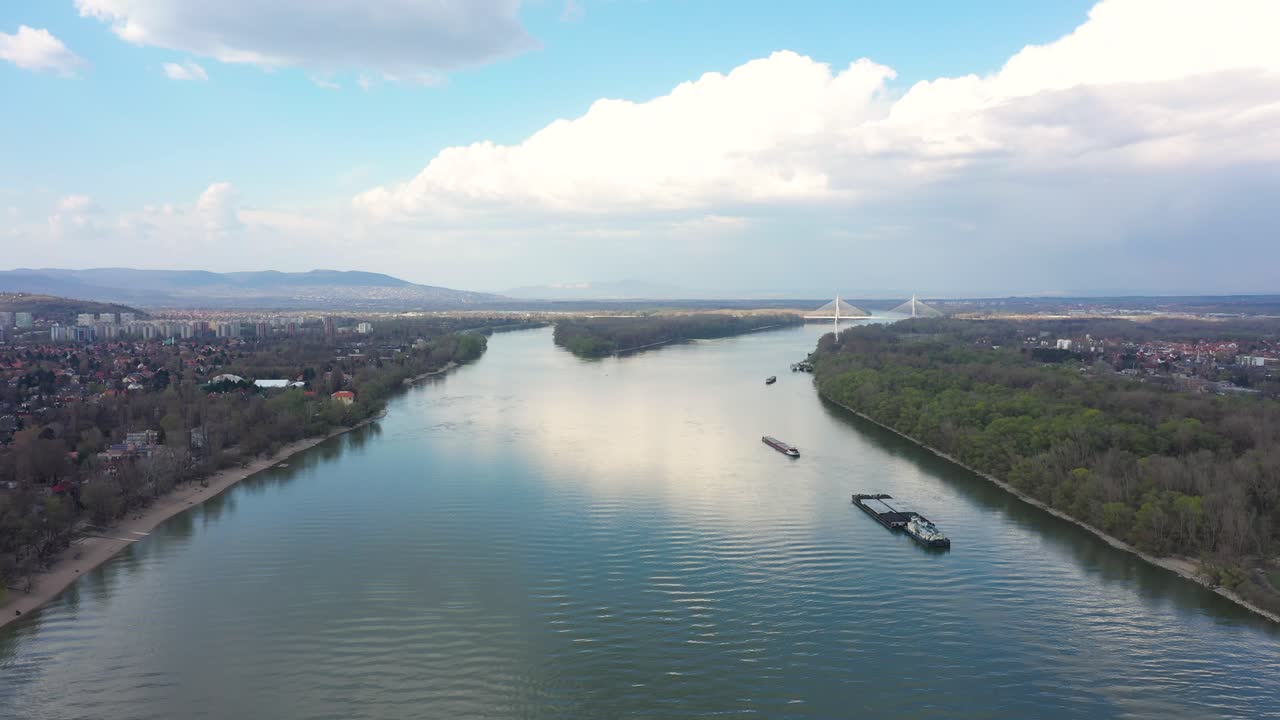 Drone footage from Danube river in spring nice weather, Budapest drone moves fast forward on high altitude