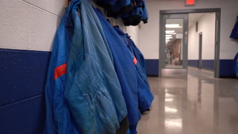 Prison-blues-blue-jackets-of-inmates-prisoners-in-prison-on-hanger-4k
