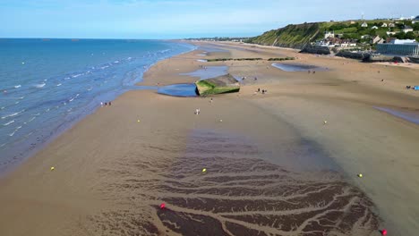 approaching aerial movement to the settlement arromanches-les-bains historical remain, france