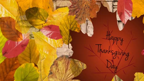 animation of happy thanksgiving day text over wooden background with autumn leaves