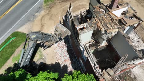 building demolition with excavator