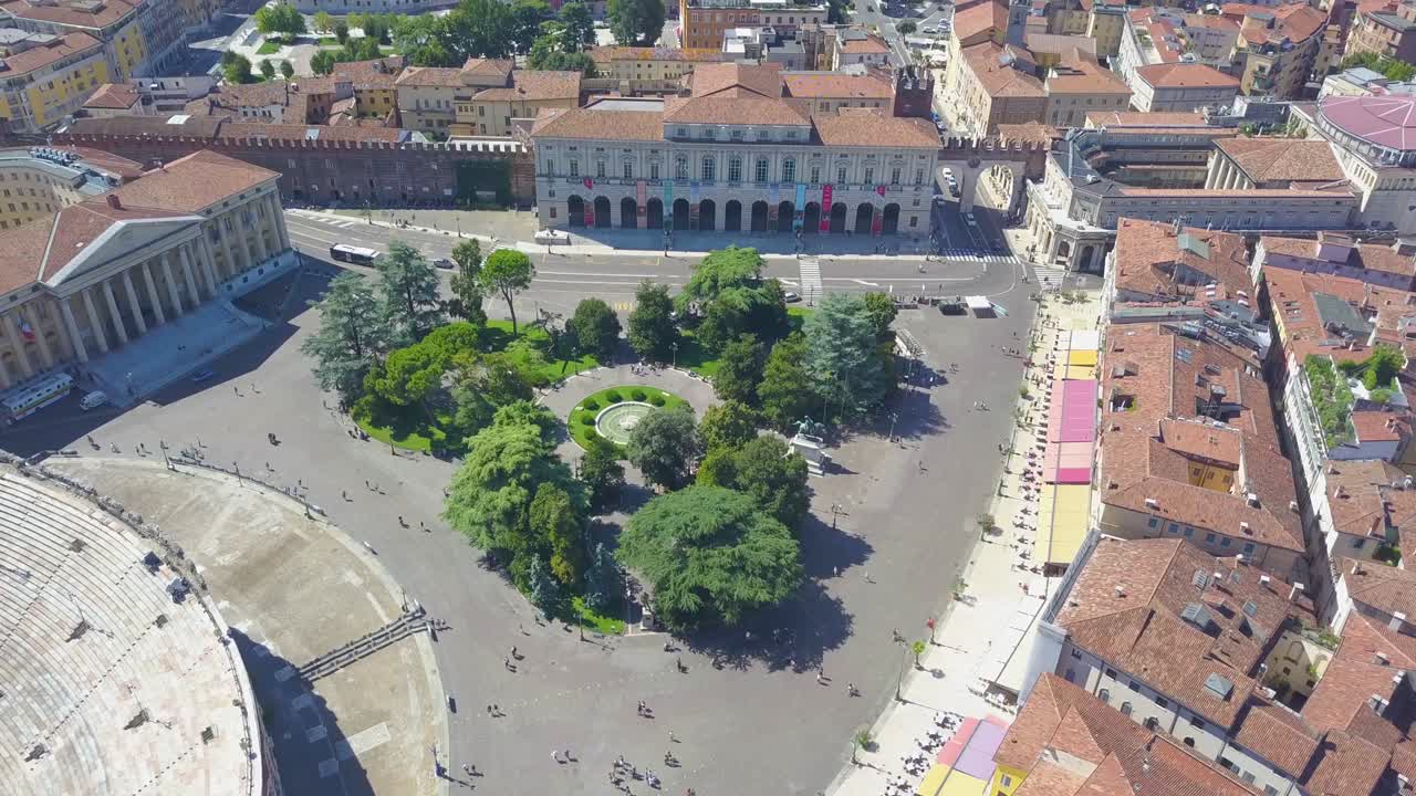 Aerial panoramic view of Arena di Verona, Italy. The drone is filming from above Bra Square and people walking. A view of the Arena and the city opens. 4k vieo.